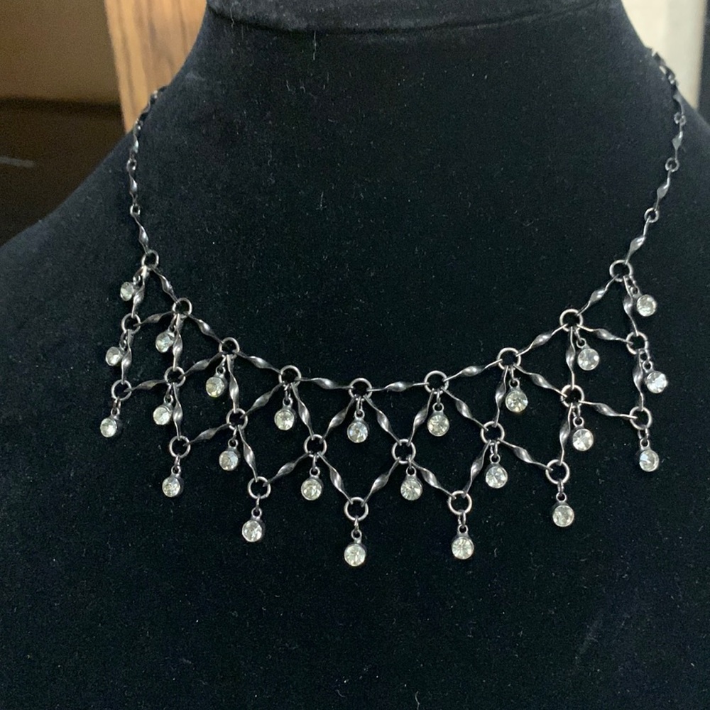 Beautiful black metal and crystal like stones linked together necklace.